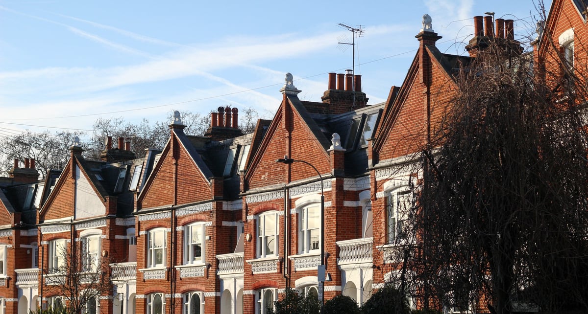 Traditional red brick Victorian terraced houses in a London neighbourhood